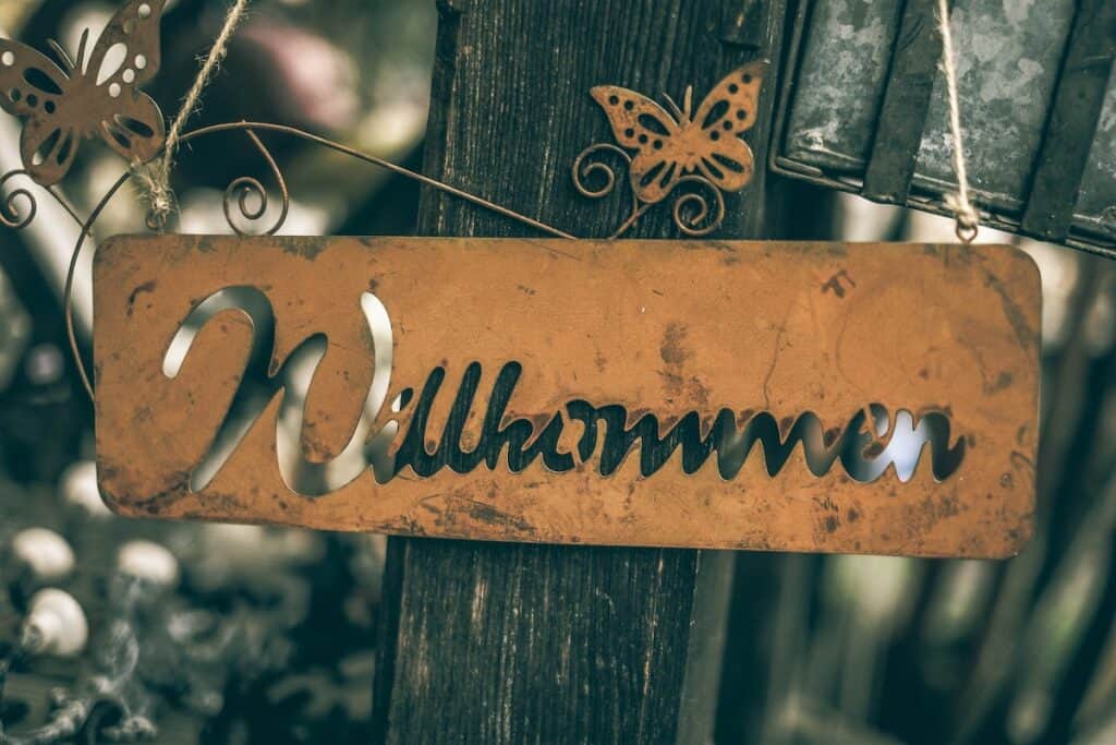 A wooden sign with the word "Wilhelmin" hanging on it, perfect for those looking to learn German or learn German online.